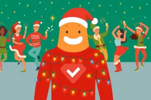 SurveyLegend mascot in a Santa hat and Christmas lights at an office holiday party with coworkers dancing and celebrating.